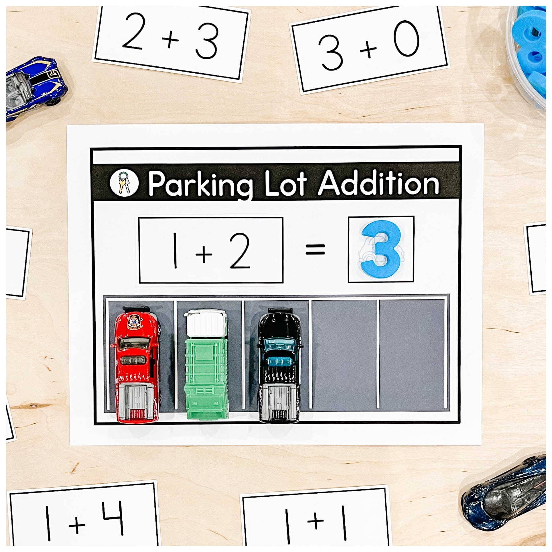 An addition centre for Kindergarten where students use toy cars to solve addition sentences