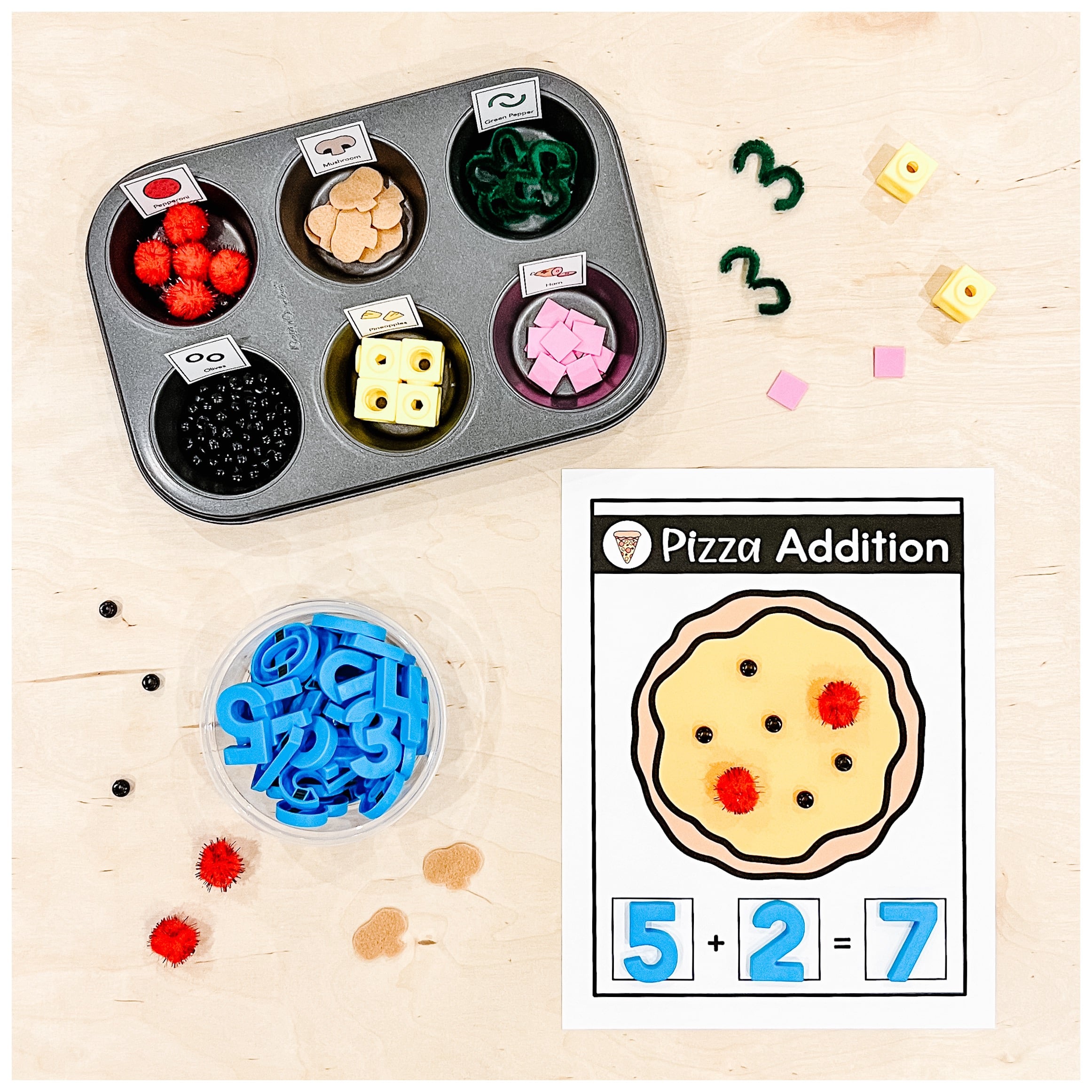 A hands-on addition centre for Kindergarten where students use pretend pizza toppings to solve addition sentences